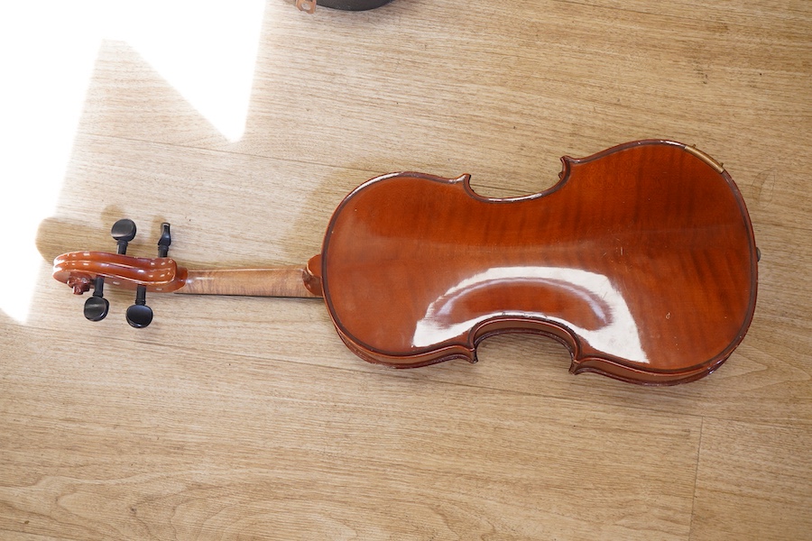 A cased students violin